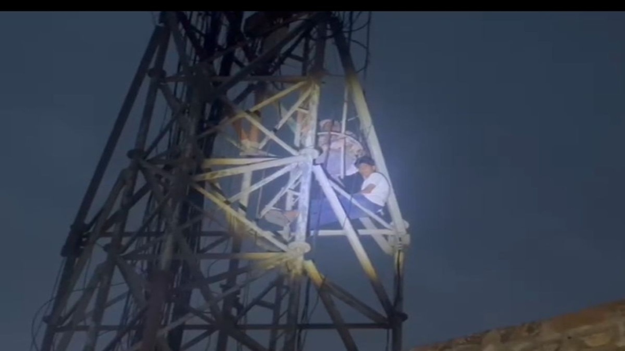 Mother Climbs Mobile Tower After Framing Son in False Case by Police in Mansa